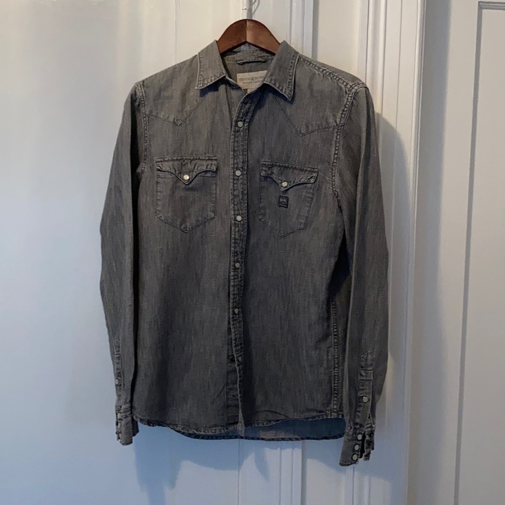 Denim shirt with white snap closures
